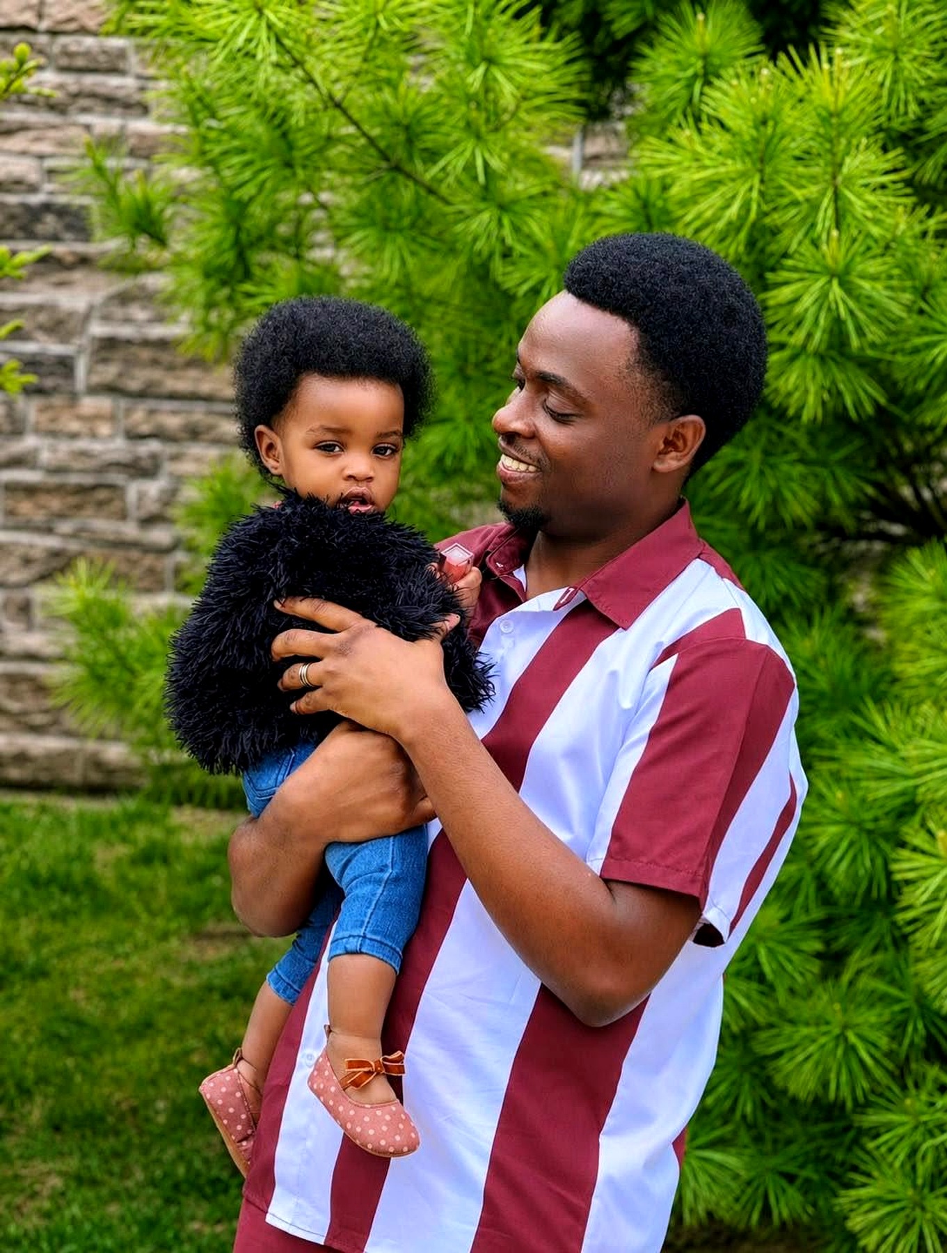 Father holding his child outdoors